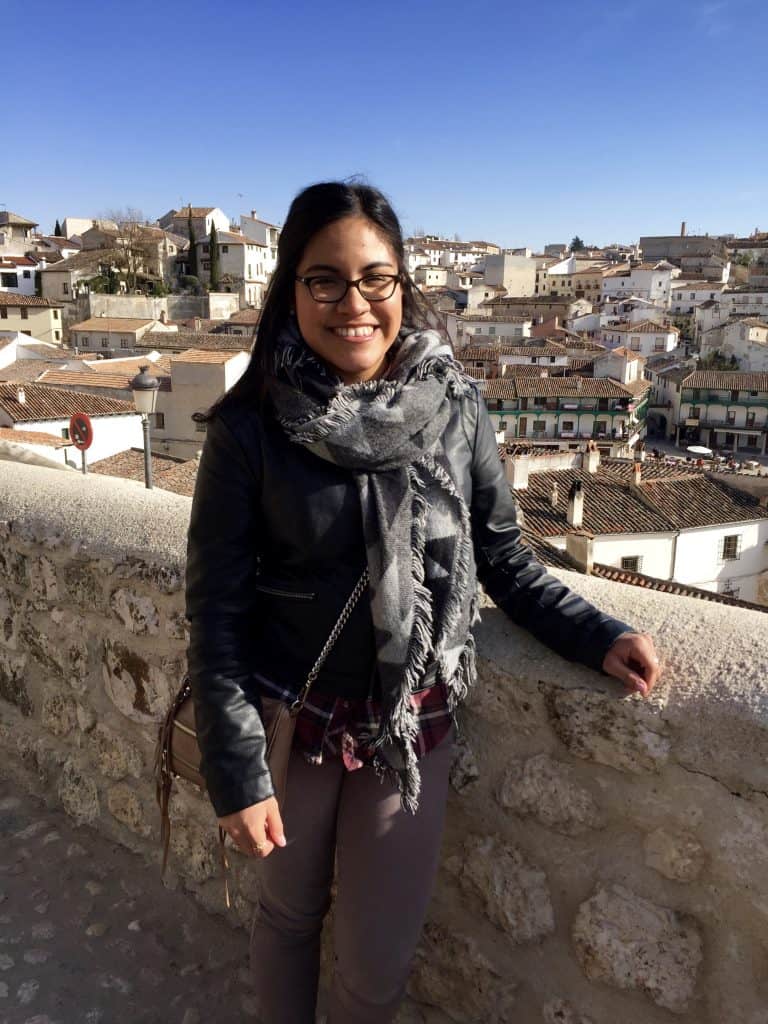girl with black jacket posing in Spanish town