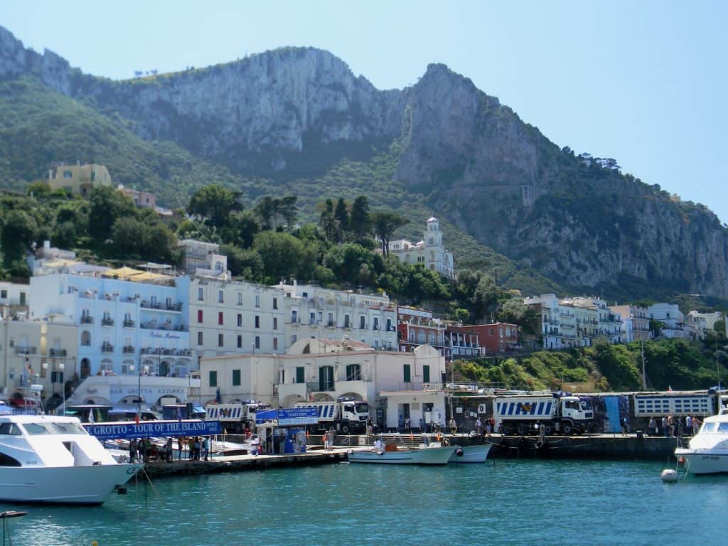 italian landscape of sea and mountain an blue water and boats