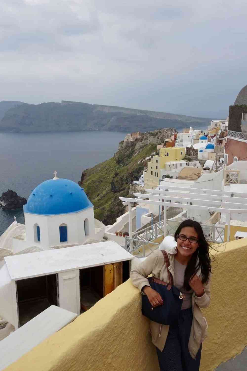 girl standing in santorini, greece happy