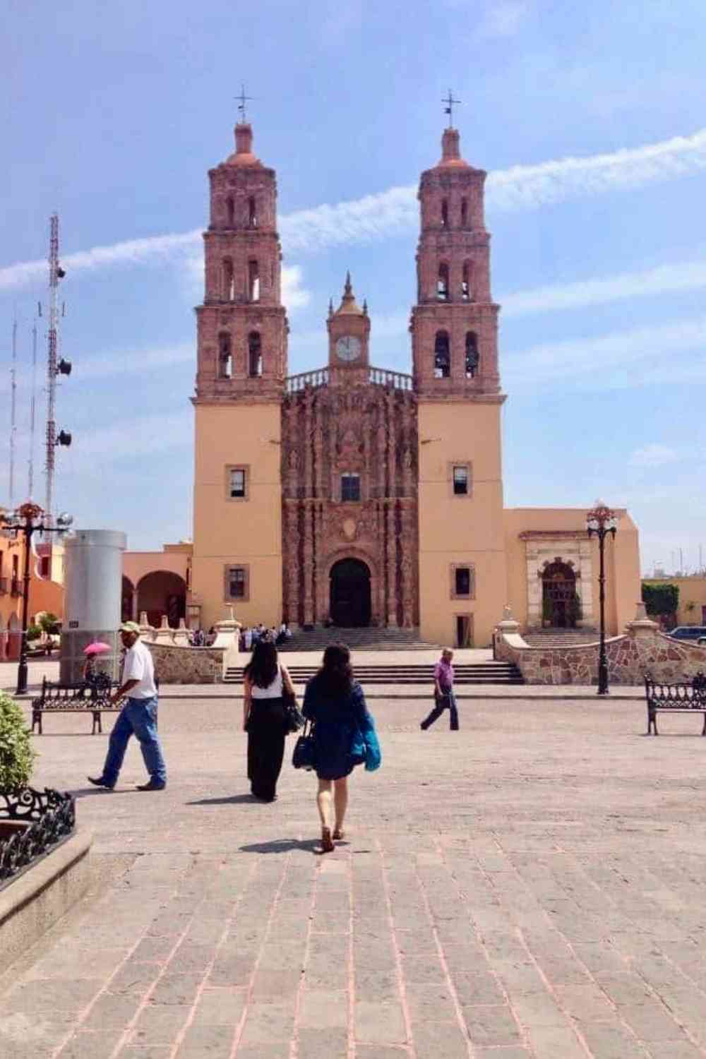 2 girls walking to a church in Mexico