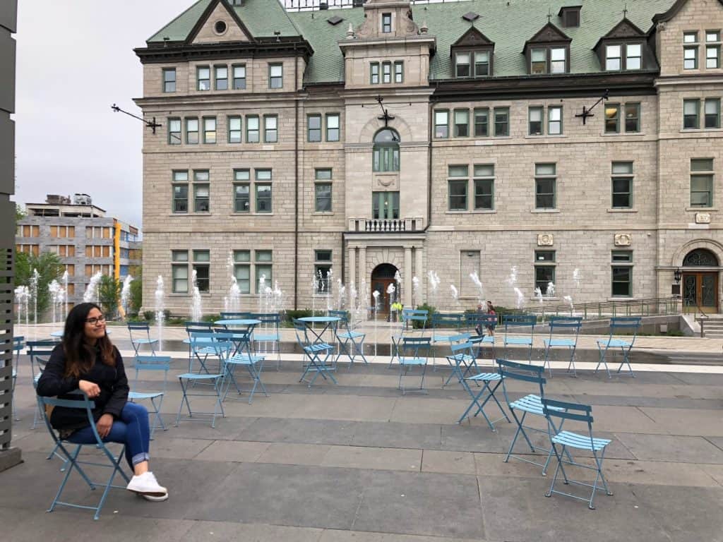 girl sitting in a blue chair in quebec city canada