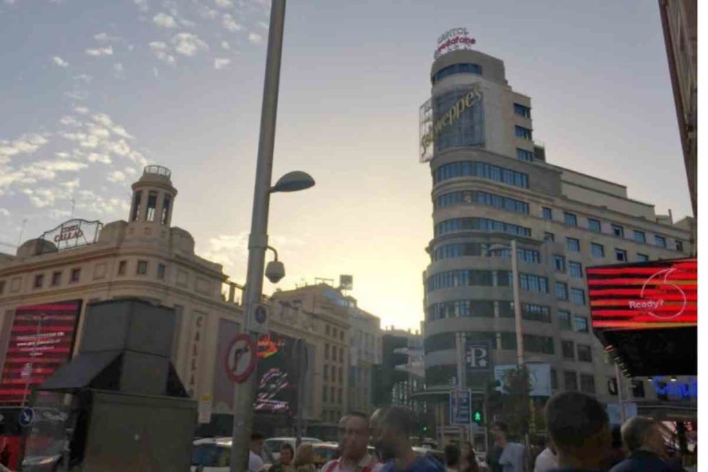 Madrid Gran Via at sunset Schweppe's building