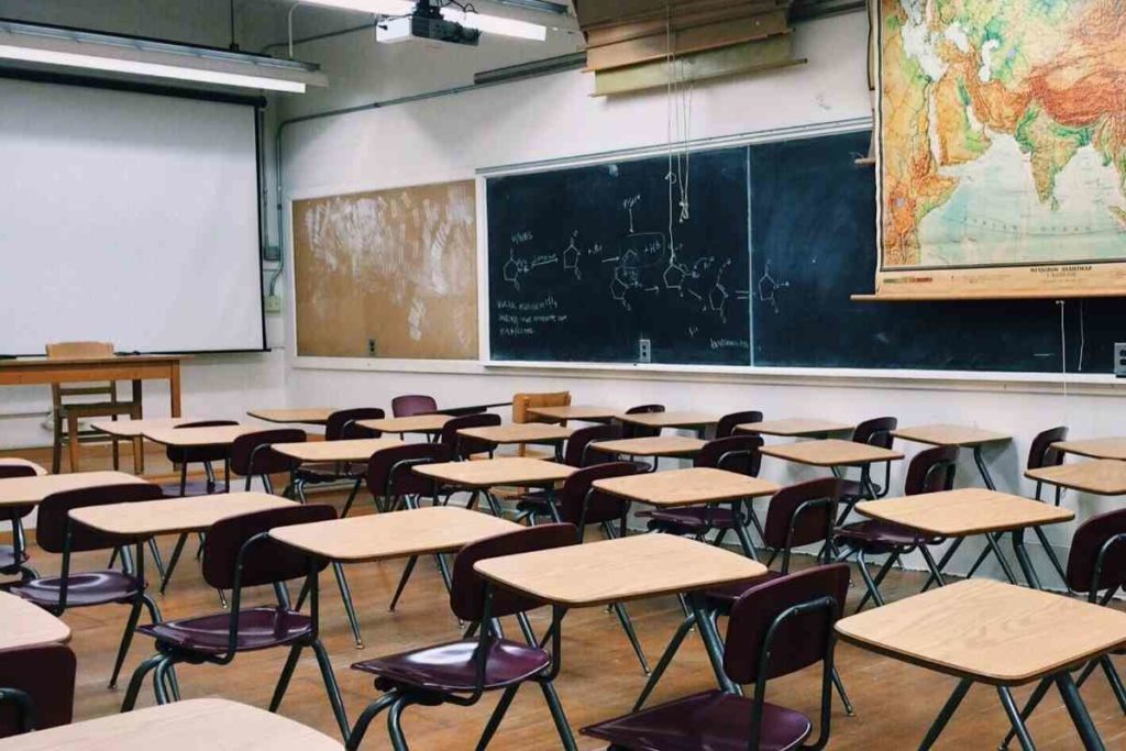A classroom with a white board and chalkboard