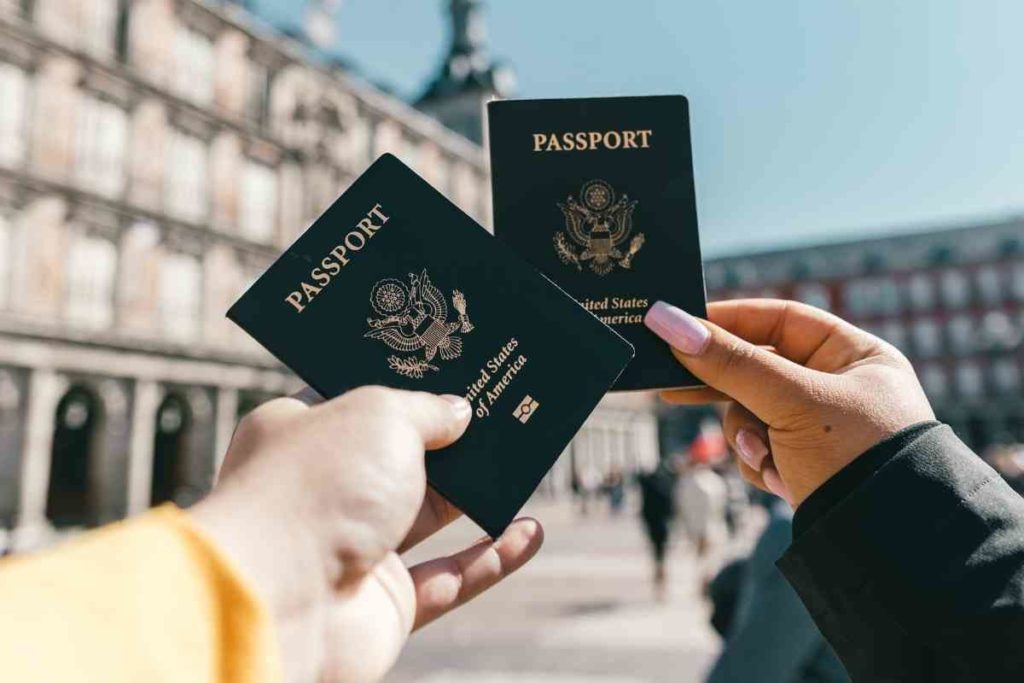 two girls holding  U.S. passports while studying abroad