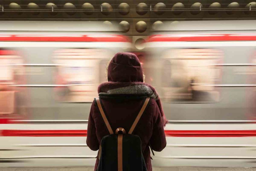 girl standing by metro while studying abroad