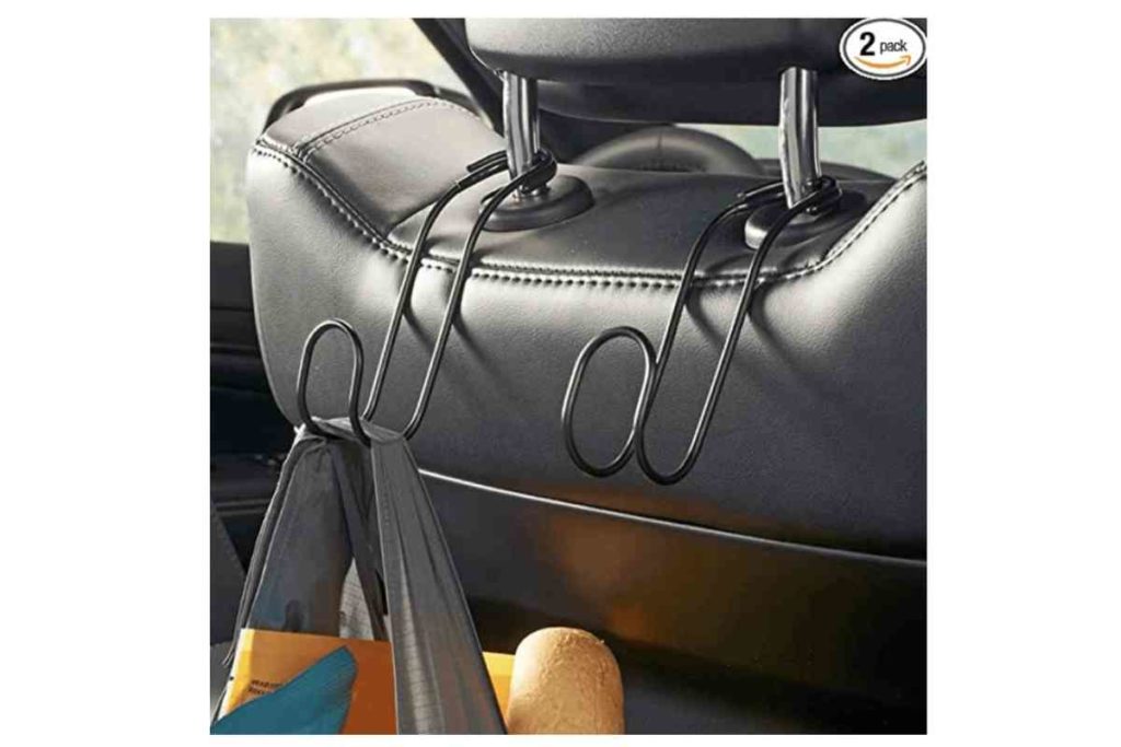 car accessory car headset hangers holding a shopping bag Car Accessories For Your Next Road Trip