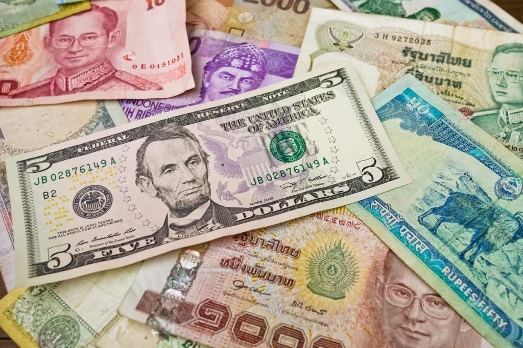 close up of different currencies from all over the world such as US dollars