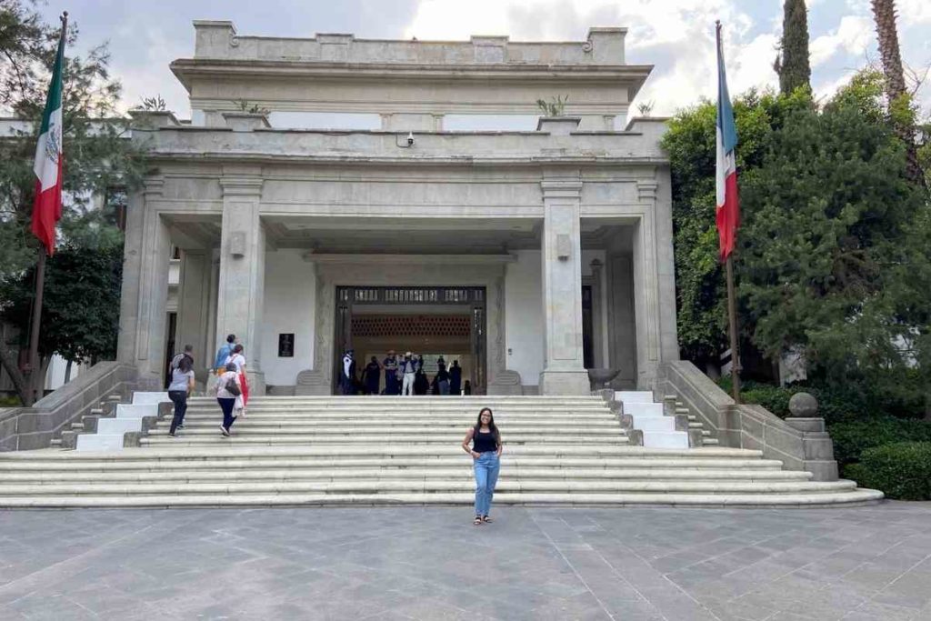 girl standing outside the culture complex Los Pinos in Chapultepec Park Mexico City