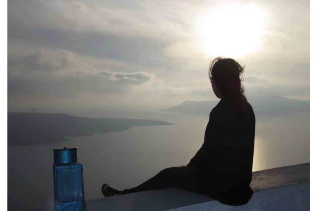 silhouette of girl looking out to the aegean sea