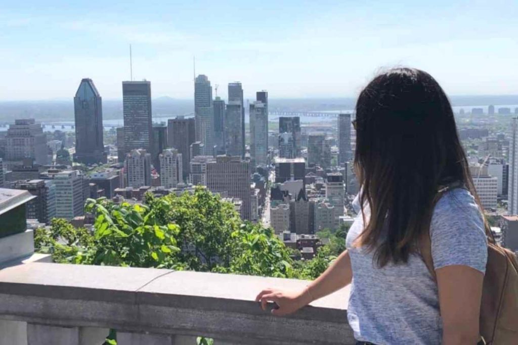 girl with black and brown hair starting off onto Montreal from a day trips from quebec city