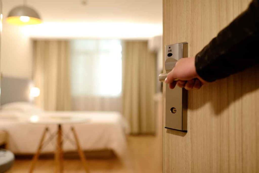 Best Safety Tips as a Solo Latina Traveler someone opening the door of a hotel

